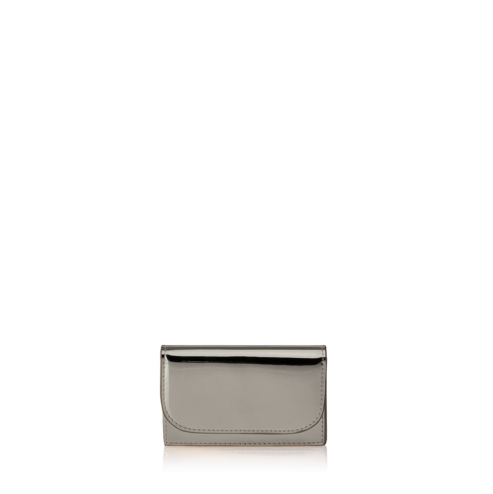 Julian Petit Warm silver metallic card case with Iris Maree logo on the inside pocket and golden press button