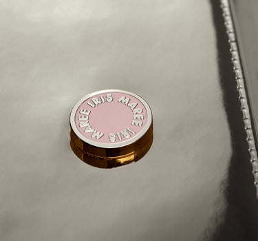 close up shot of Julian petite warm silver metallic pink and white Iris Maree logo on card case