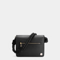 Luxury shoulder and crossbody bag in black, handcrafted from vegan leather and sustainable, cruelty-free Kayla Fabric™—an eco-friendly leather alternative. Designed by a Dutch designer, this authentic bag combines a sleek, rectangular shape with a knotted handle, offering versatility and style for any occasion. Soft gold detailing adds a luxurious touch, making it the best designer handbag for those seeking an ethical, high-quality accessory. Made in Europe.