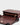 Luxury shoulder and crossbody bag in burgundy, handcrafted from vegan leather and sustainable, cruelty-free Kayla Fabric™—an eco-friendly leather alternative. Designed by a Dutch designer, this authentic bag combines a sleek, rectangular shape with a knotted handle, offering versatility and style for any occasion. Soft gold detailing adds a luxurious touch, making it the best designer handbag for those seeking an ethical, high-quality accessory. Made in Europe.