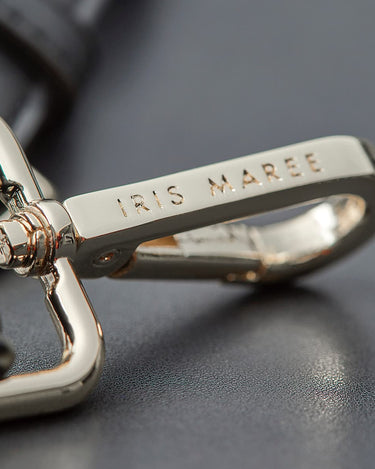 Engraved Iris Maree Logo on gold clip attached to strap