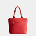 Luxury tote bag in red, handcrafted from vegan, sustainable, and cruelty-free Kayla Fabric™—an eco-friendly leather alternative. Designed by a Dutch designer, this authentic bag is spacious and structured, featuring braided handles and soft gold details. The best designer handbag for work, ideal for carrying daily essentials like laptops with style and responsibility. Made in Europe.