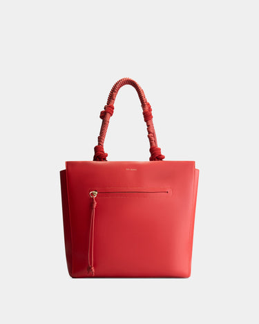 Luxury tote bag in red, handcrafted from vegan, sustainable, and cruelty-free Kayla Fabric™—an eco-friendly leather alternative. Designed by a Dutch designer, this authentic bag is spacious and structured, featuring braided handles and soft gold details. The best designer handbag for work, ideal for carrying daily essentials like laptops with style and responsibility. Made in Europe.