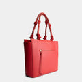 Luxury tote bag in red, handcrafted from vegan, sustainable, and cruelty-free Kayla Fabric™—an eco-friendly leather alternative. Designed by a Dutch designer, this authentic bag is spacious and structured, featuring braided handles and soft gold details. The best designer handbag for work, ideal for carrying daily essentials like laptops with style and responsibility. Made in Europe.