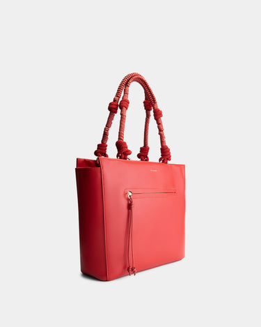 Luxury tote bag in red, handcrafted from vegan, sustainable, and cruelty-free Kayla Fabric™—an eco-friendly leather alternative. Designed by a Dutch designer, this authentic bag is spacious and structured, featuring braided handles and soft gold details. The best designer handbag for work, ideal for carrying daily essentials like laptops with style and responsibility. Made in Europe.