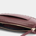 Luxury mini shoulder bag in burgundy, handcrafted in collaboration with AVDW Antwerp from vegan, sustainable, and cruelty-free Kayla Fabric™—an eco-friendly leather alternative. Designed by a Dutch designer, this authentic bag features a compact, curved design with hand-knotted cords and soft gold accents, blending artistry with practicality. The best designer handbag for those seeking ethical elegance. Made in Europe.