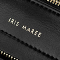 close up Iris Maree logo in gold on made from environmentally conscious material Kayla Fabric