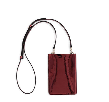 Merry Pouch Ruby Red Metallic phone case bag with long cross-body strap and gold accessory clips on bag with gold Iris Maree logo on the front of the bag made from environmentally conscious material Kayla Fabric